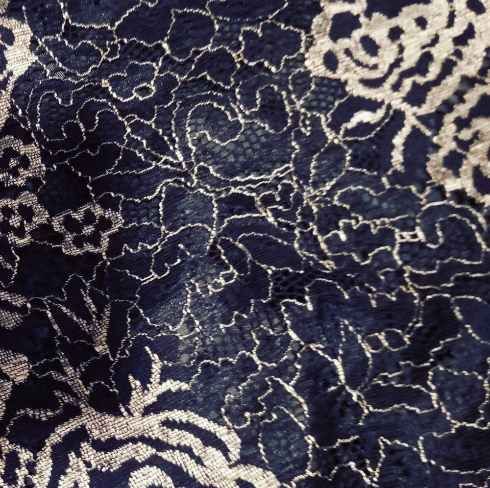 This is a lace floral gold and black crop top